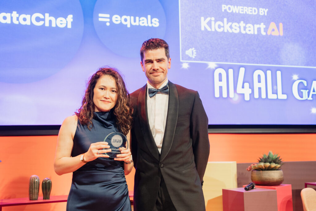 Dr. Rimma Dzhusupova Accepting AI4Her Earth Award From Erik Webbe, KickstartAI CEO, photo credit: Lera Manzovitovava