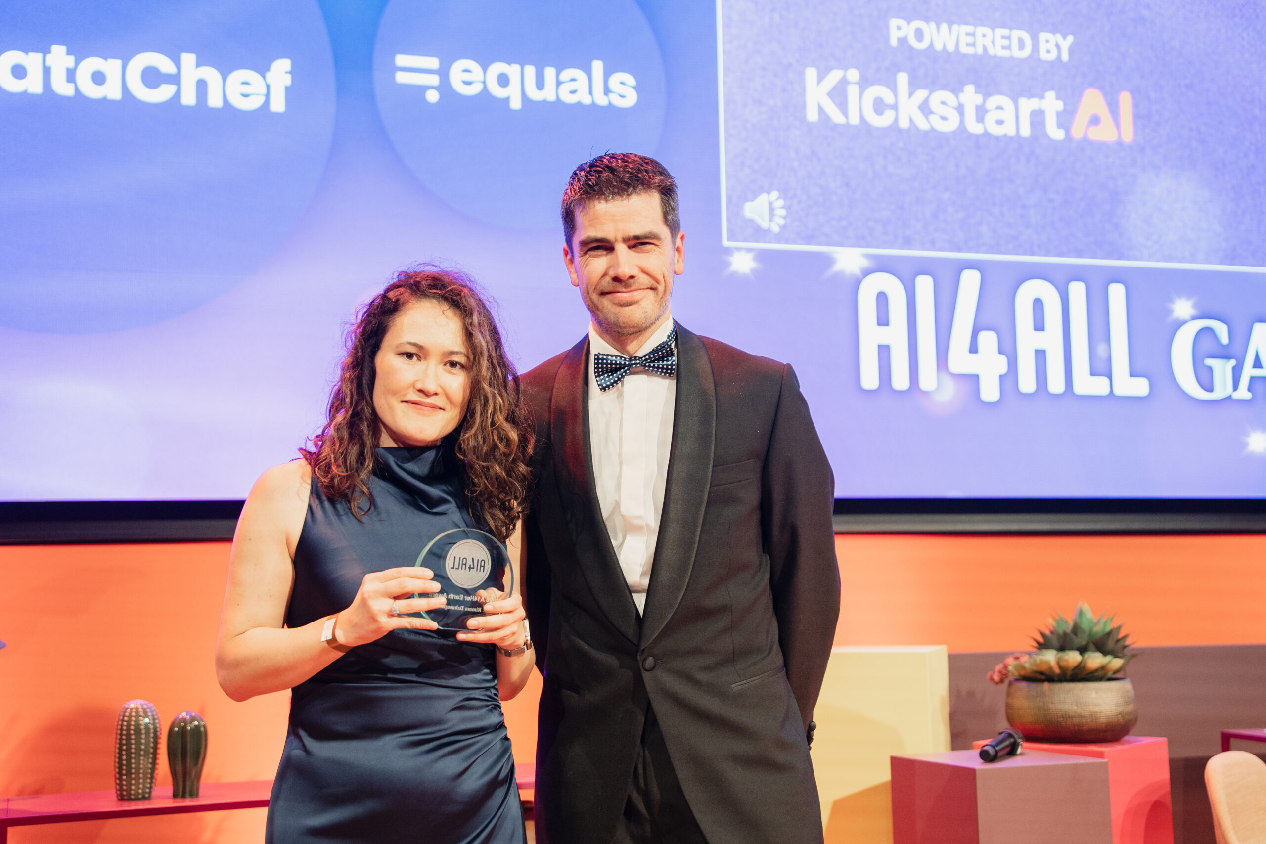 Dr. Rimma Dzhusupova Accepting AI4Her Earth Award From Erik Webbe, KickstartAI CEO, photo credit: Lera Manzovitovava